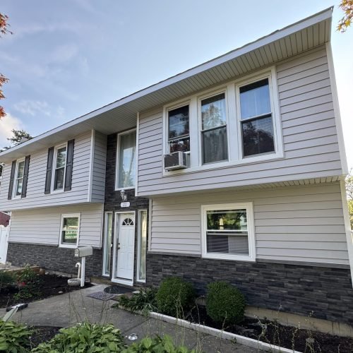Professional siding installation on residential home